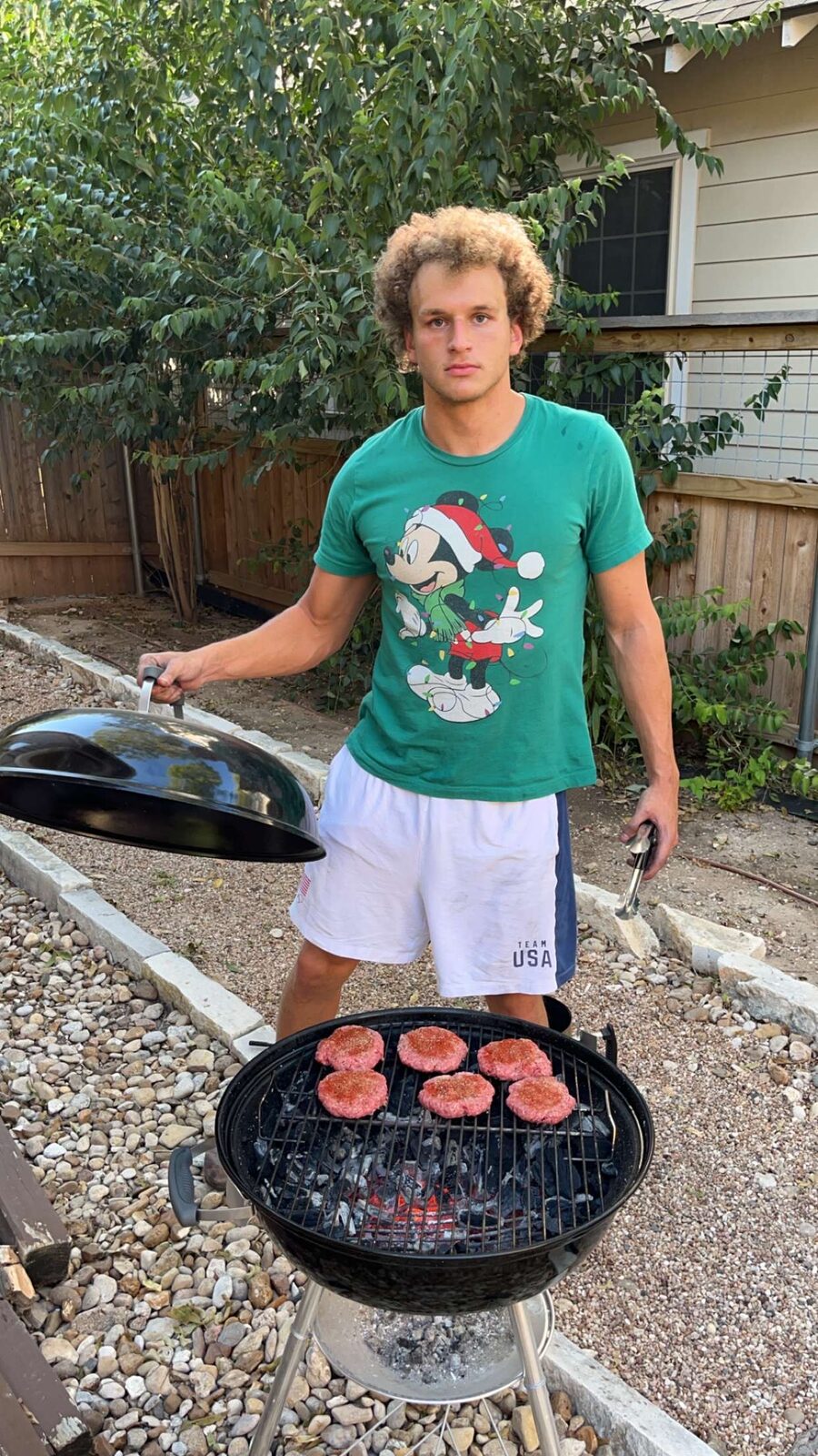 Grilling burgers in the backyard
